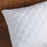 Waterproof quilted pillow protectors with a soft, textured surface, designed to fit standard-sized pillows.