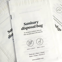 Close up image of plastic sanitary bag with written information